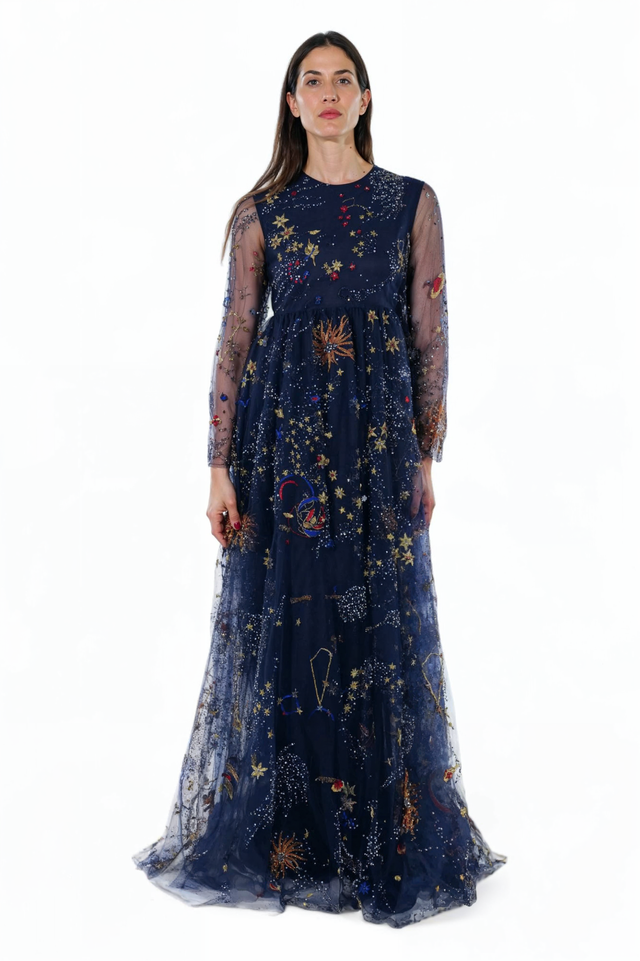 Valentino midnight blue celestial embroidered tulle gown with sheer long sleeves and flowing A-line skirt.