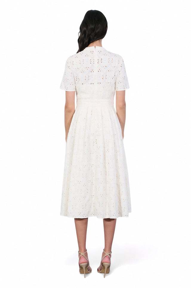 MSA Haute Couture ivory eyelet midi dress with short sleeves, tie waist, and button-front bodice. Perfect for summer events.