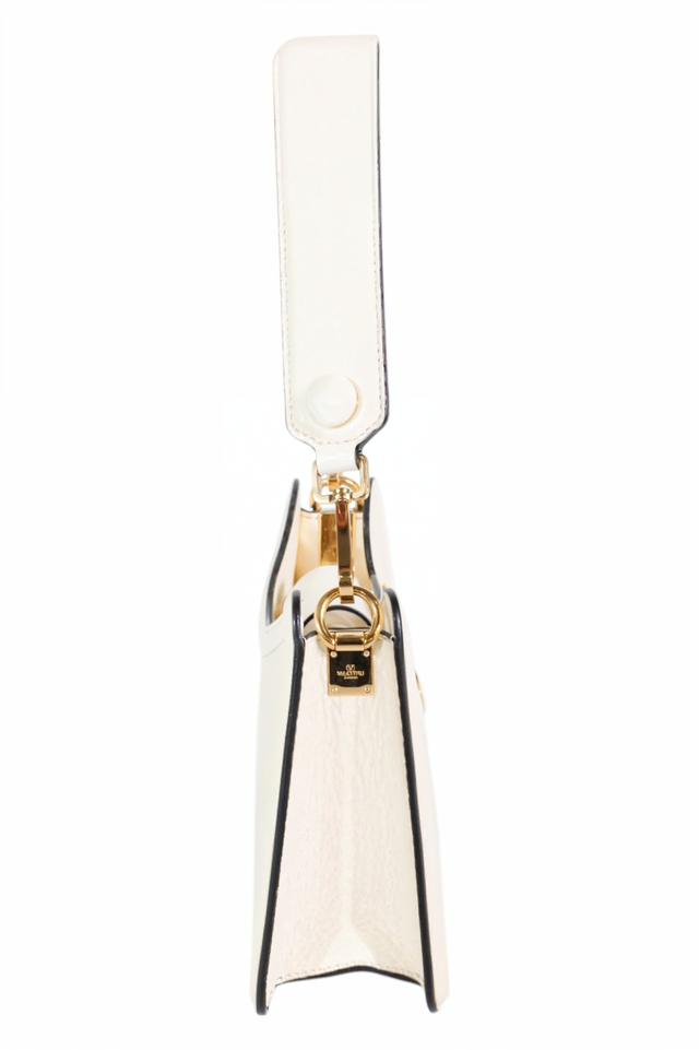 Valentino Garavani white leather VLogo Moon bag, side view — sculpted design with gold hardware and thick strap.