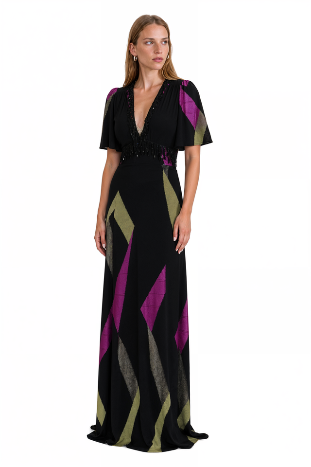Side view of an Etro black and magenta patchwork gown with beaded fringe