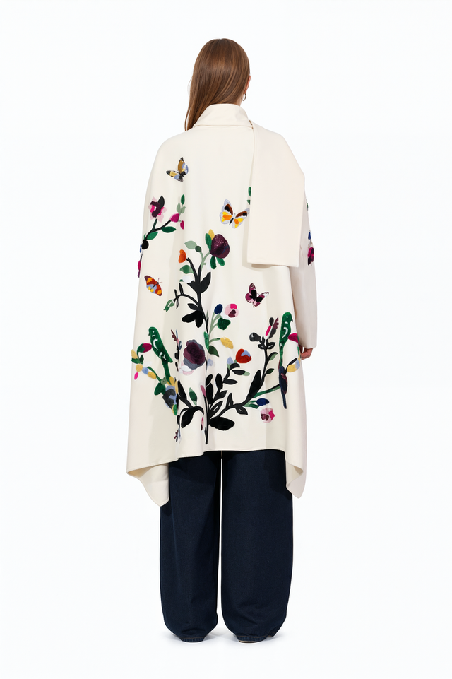 Back view of a Valentino ivory wool coat with multicolour floral appliqué