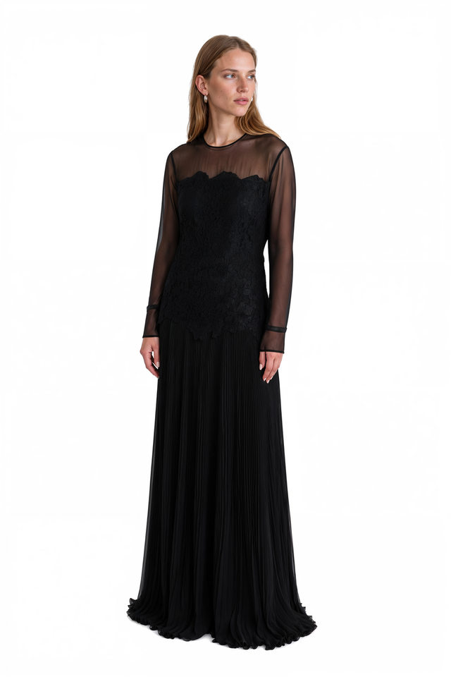 Three-quarter view of a Valentino black lace bodice gown with sheer sleeves