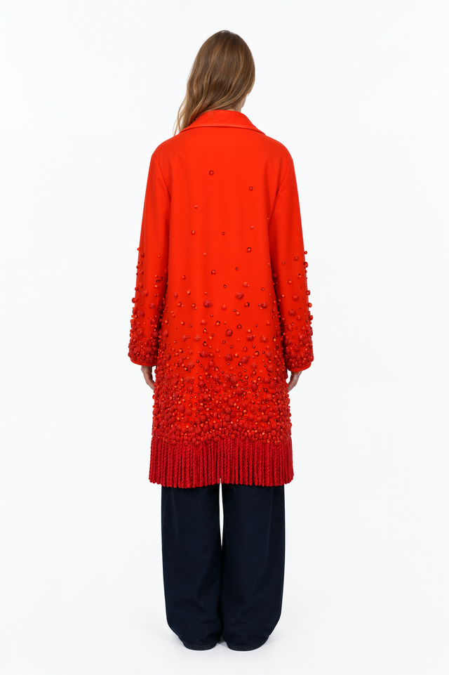Back view of a Valentino orange-red beaded wool coat with deep cord fringe
