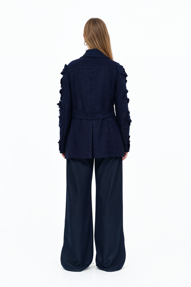 Side view of a Valentino navy cutwork floral peacoat