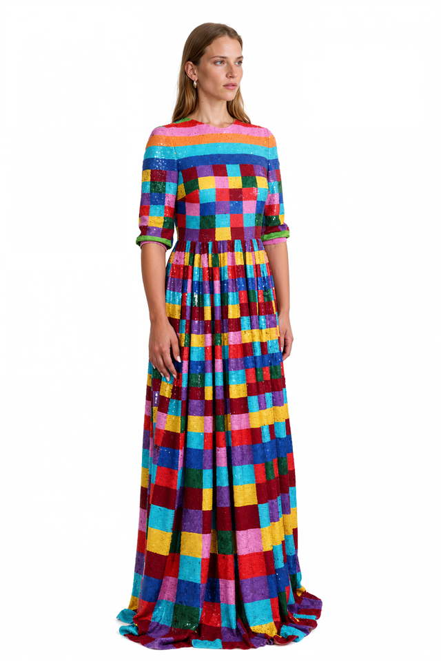 Side view of a Valentino rainbow check sequin gown with gathered full skirt