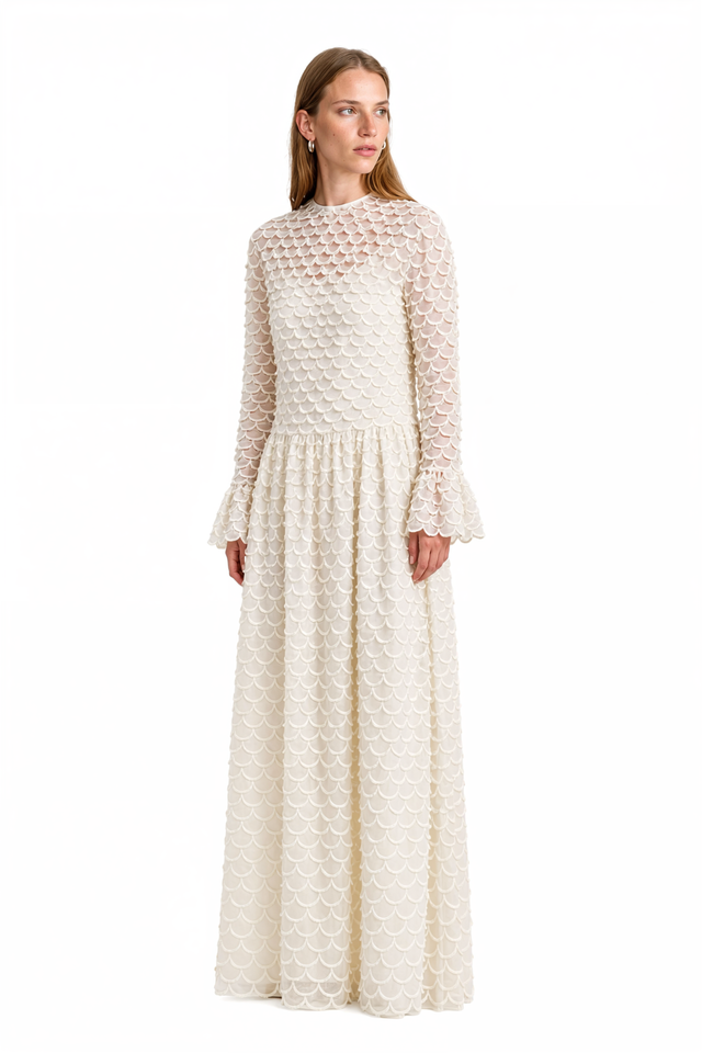 Three-quarter view of Valentino ivory scalloped lace gown showing the full A-line skirt
