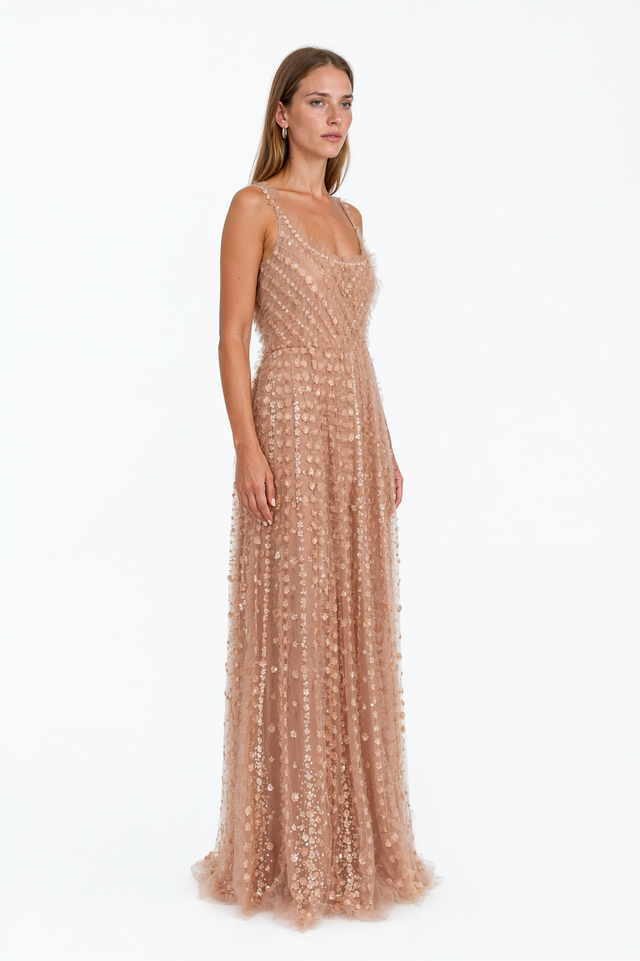 Side view of a Valentino sequin floret tulle gown with ruffled straps and full A-line skirt