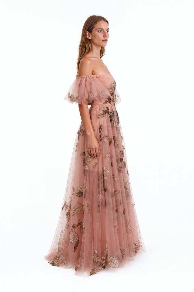 Side view of a Valentino pink metallic floral tulle gown with full A-line skirt