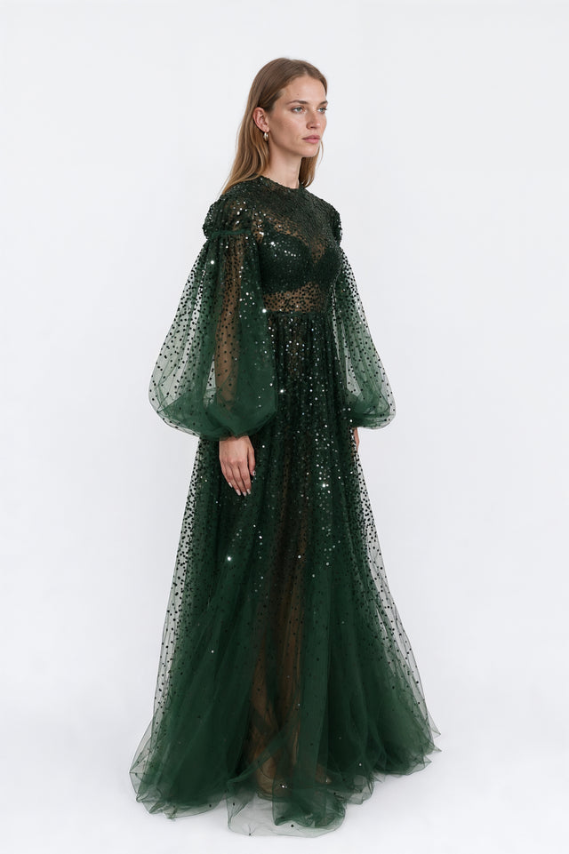 Side view of a Valentino bottle green sequin-embellished tulle gown with full bishop sleeves