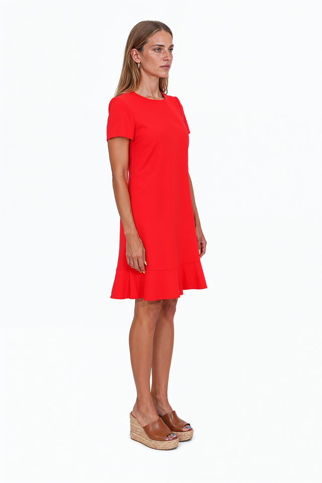 Red Valentino red mini dress with a playful ruffle hem, round neckline and tailored streamlined silhouette.