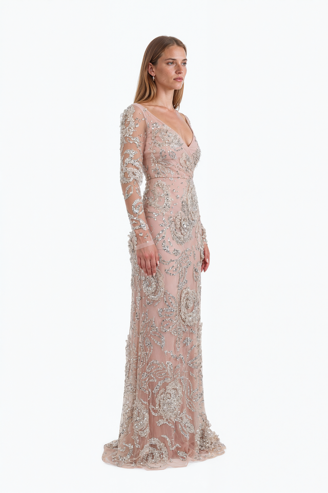 Side view of a Valentino blush beaded tulle gown showing the fitted column silhouette and trailing hem