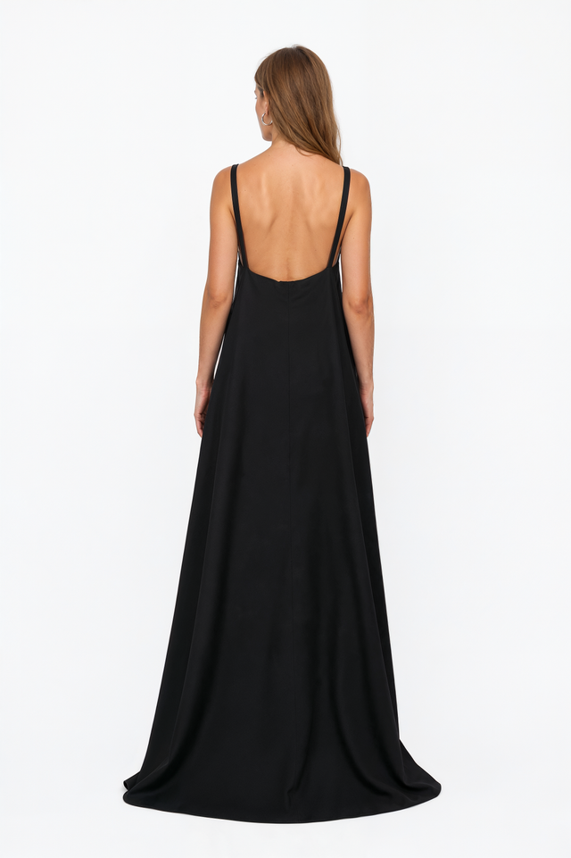 Back view of a Valentino black gown showing the deep open back and crossing straps