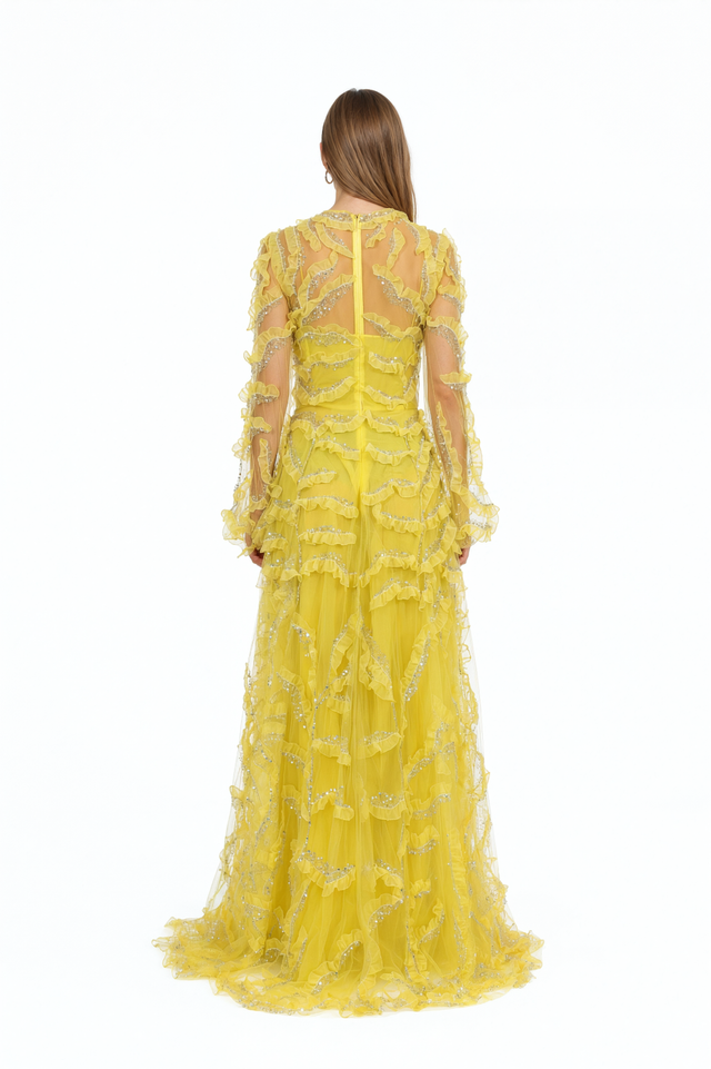 Back view of a Valentino yellow beaded ruffle tulle gown with sheer sleeves