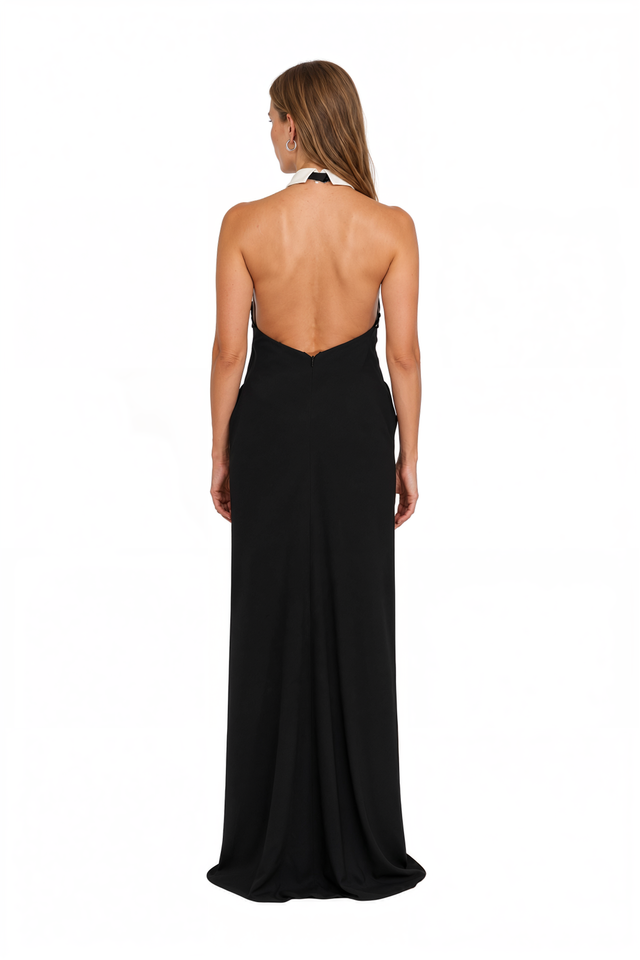 Back view of a Valentino black column gown with bare back and halter collar