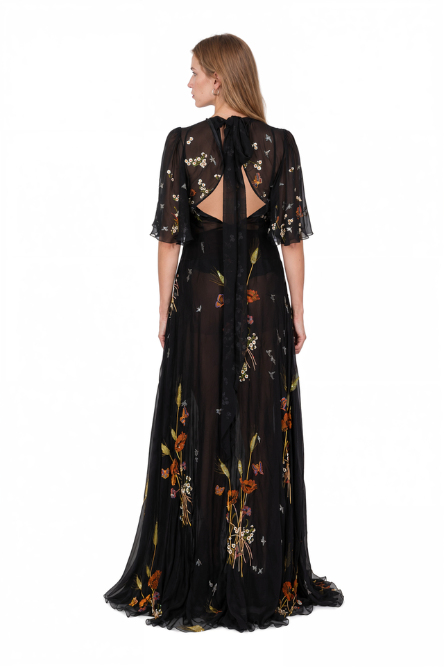 Back view of a Valentino black embroidered chiffon gown with sweeping skirt