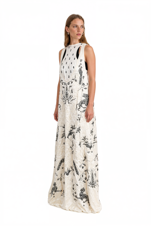 Side view of a Valentino ivory embroidered menagerie gown with side cutouts
