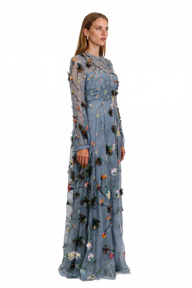 Side view of a Valentino blue embroidered sheer tulle gown