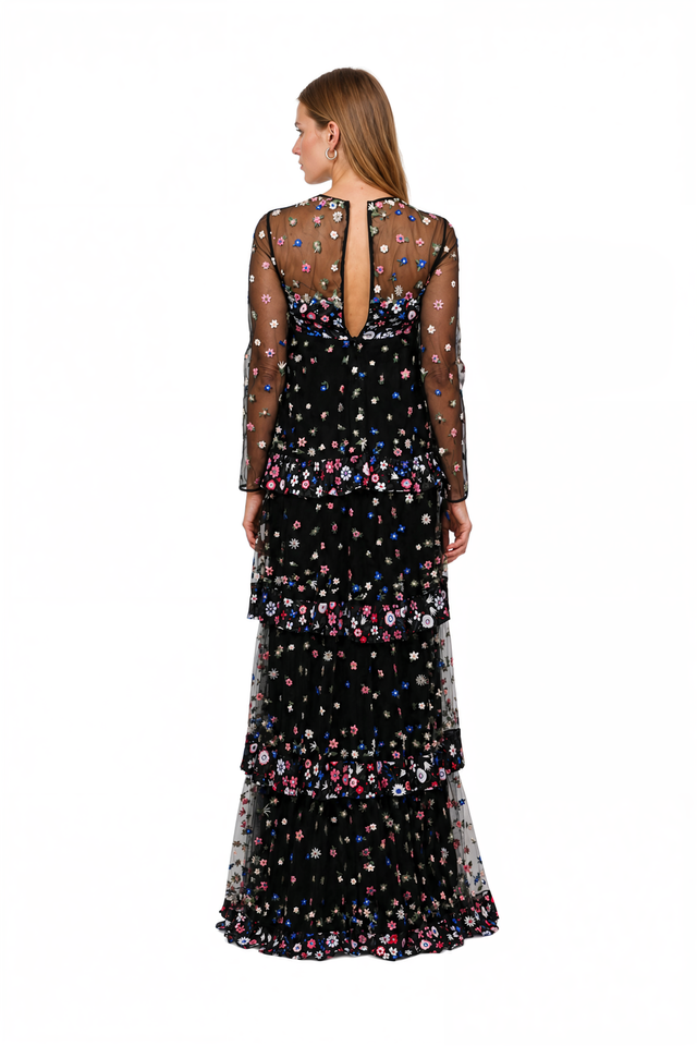 Back view of a Valentino black ditsy floral tulle gown with tiered skirt
