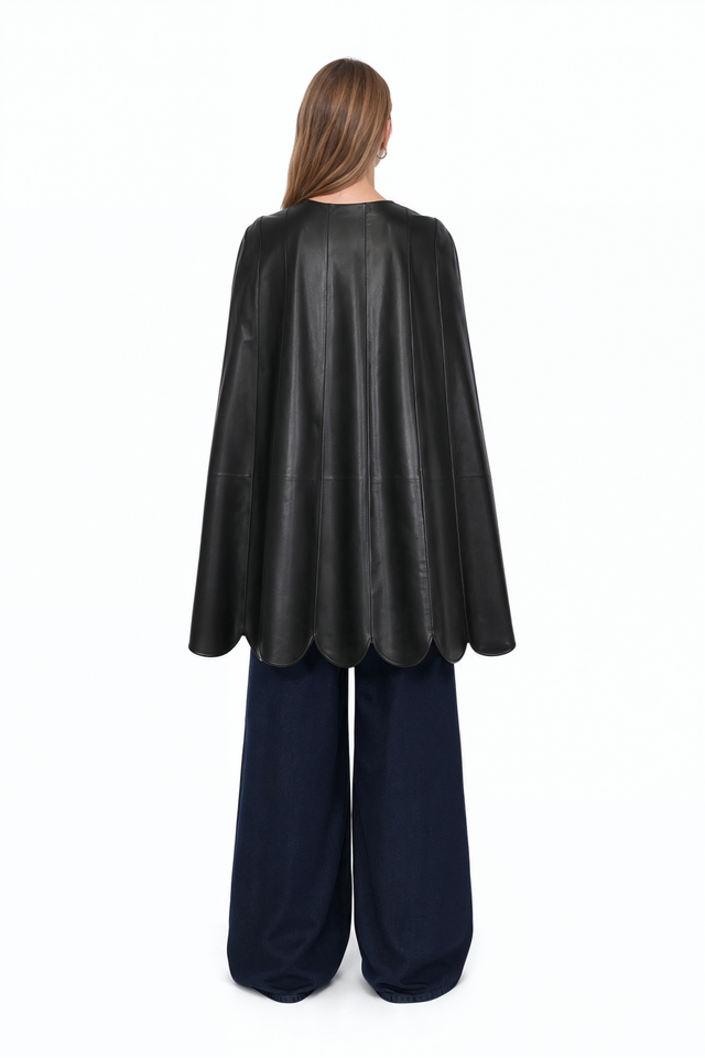 Back view of a Valentino scalloped leather cape