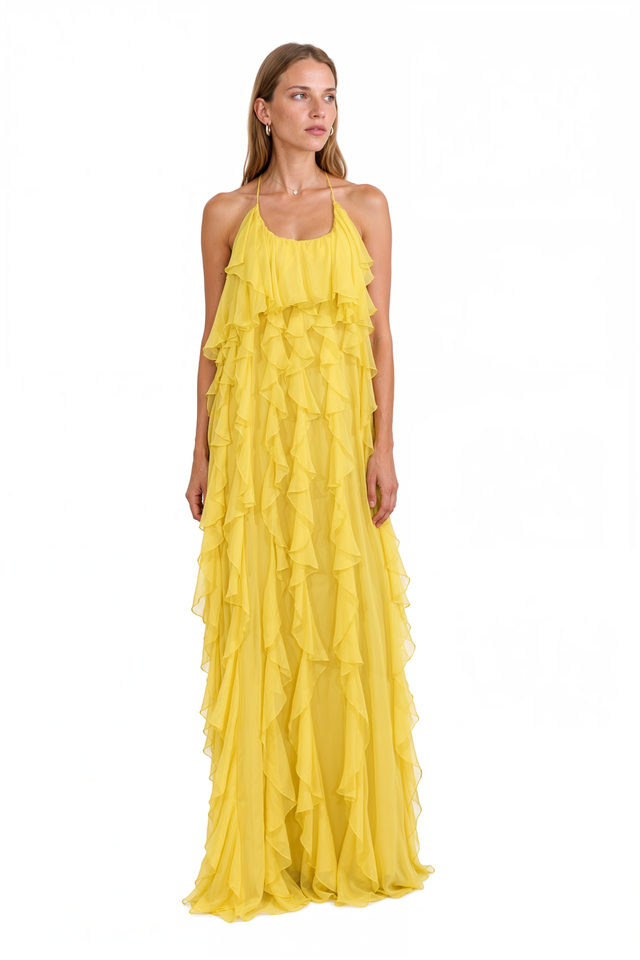 Side view of a Valentino yellow tiered ruffle chiffon gown