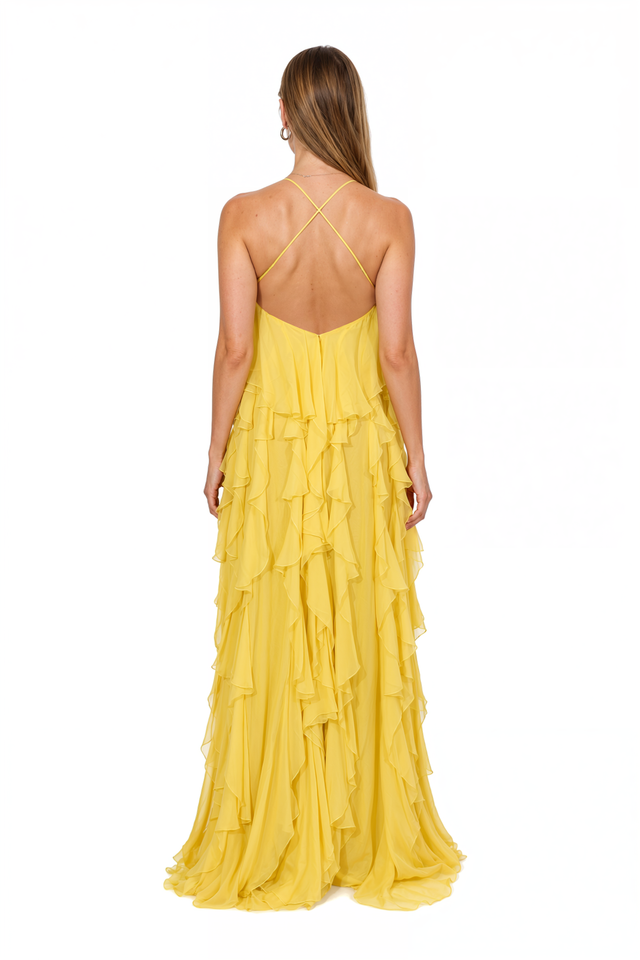 Back view of a Valentino yellow ruffle gown with bare back and halter tie
