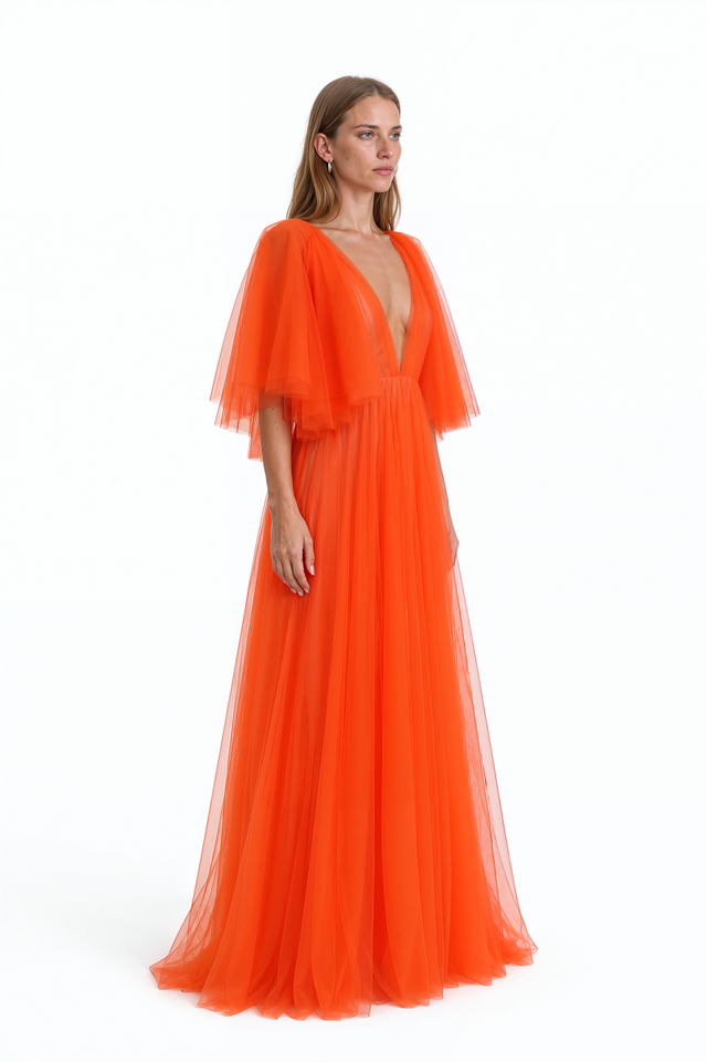 Side view of a Valentino orange pleated tulle gown with full floor-length skirt