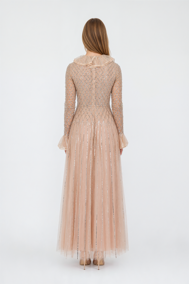 Back view of a Valentino champagne crystal-beaded tulle gown with concealed zip and floor-length pleated skirt