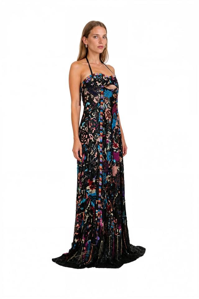 Side view of a Valentino black beaded halter gown with trailing thread hem