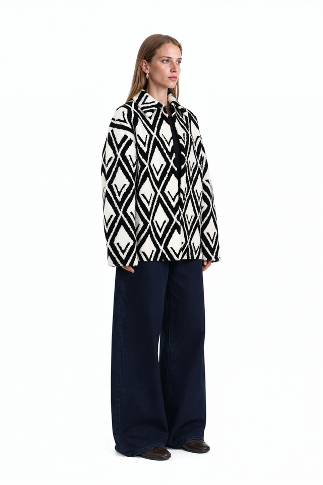 Side view of a Valentino monochrome geometric shearling jacket