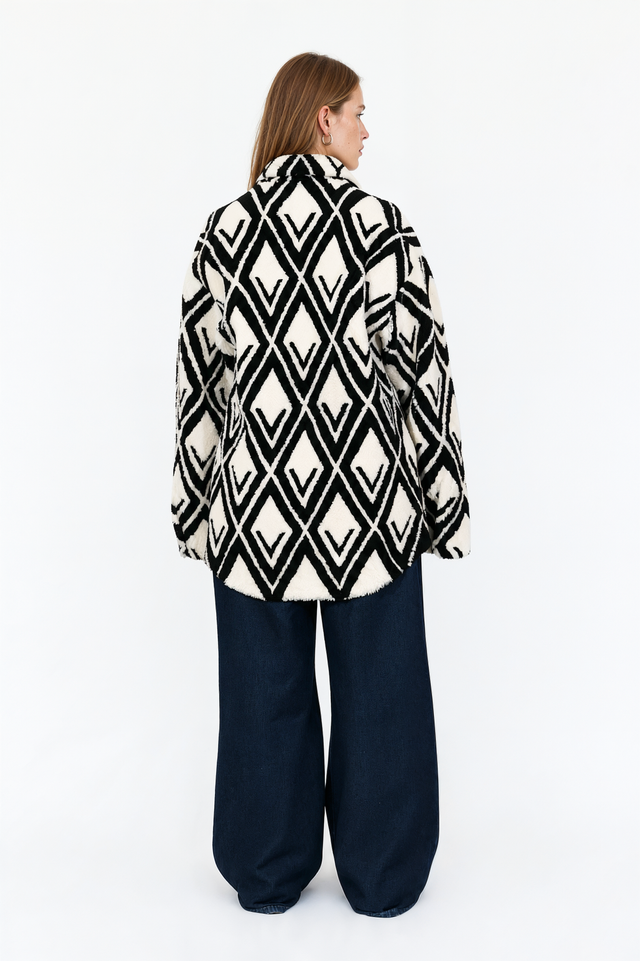 Back view of a Valentino black and ivory diamond-pattern shearling jacket