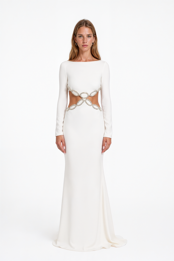 Valentino white crepe gown with boat neckline, long sleeves and crystal chain-link waist cutouts – front view