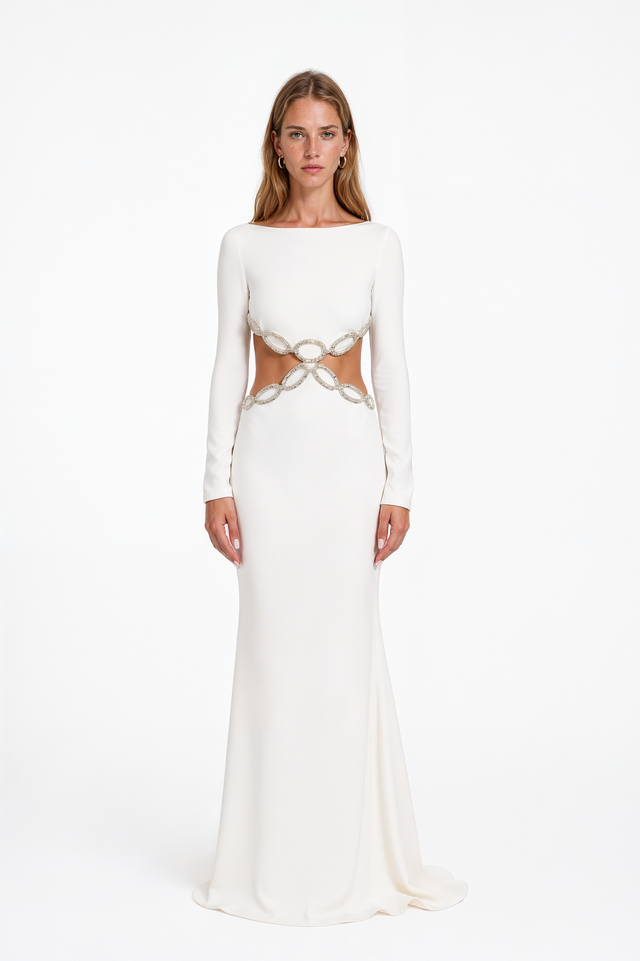 Valentino white crepe gown with boat neckline, long sleeves and crystal chain-link waist cutouts – front view
