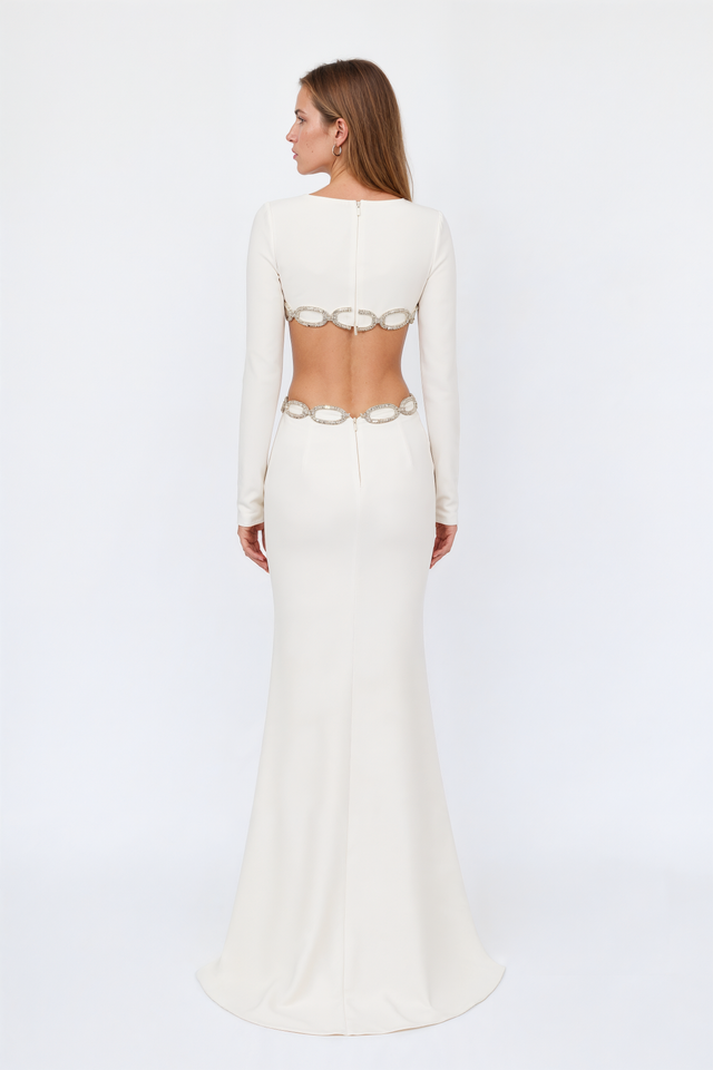 Back view of a Valentino white gown with an open back, crystal chain detail and concealed zip