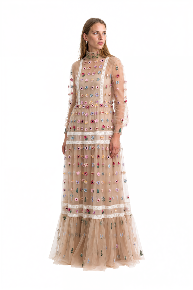 Side view of a Valentino nude tulle floral appliqué gown with bishop sleeves