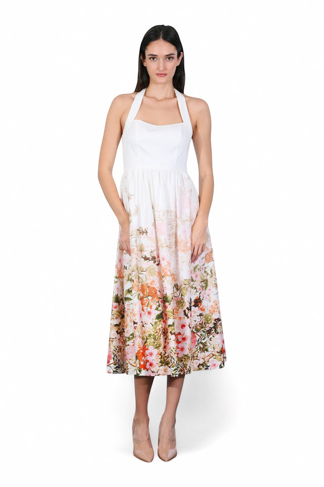 MSA Haute Couture white halter neck midi dress with vibrant floral print skirt, lightweight fabric, A-line silhouette.