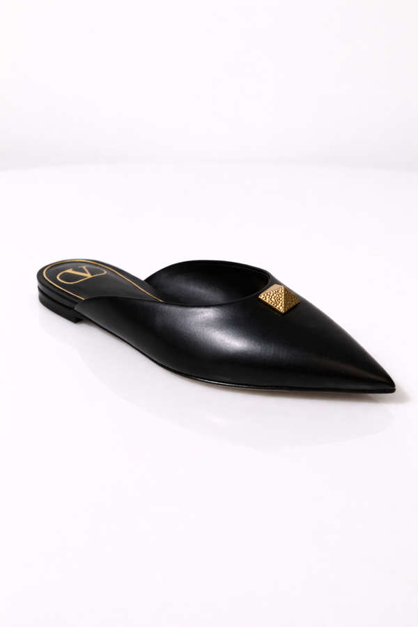 MSA Haute Couture Valentino Garavani black leather pointed-toe mule with gold-tone Rockstud detail.