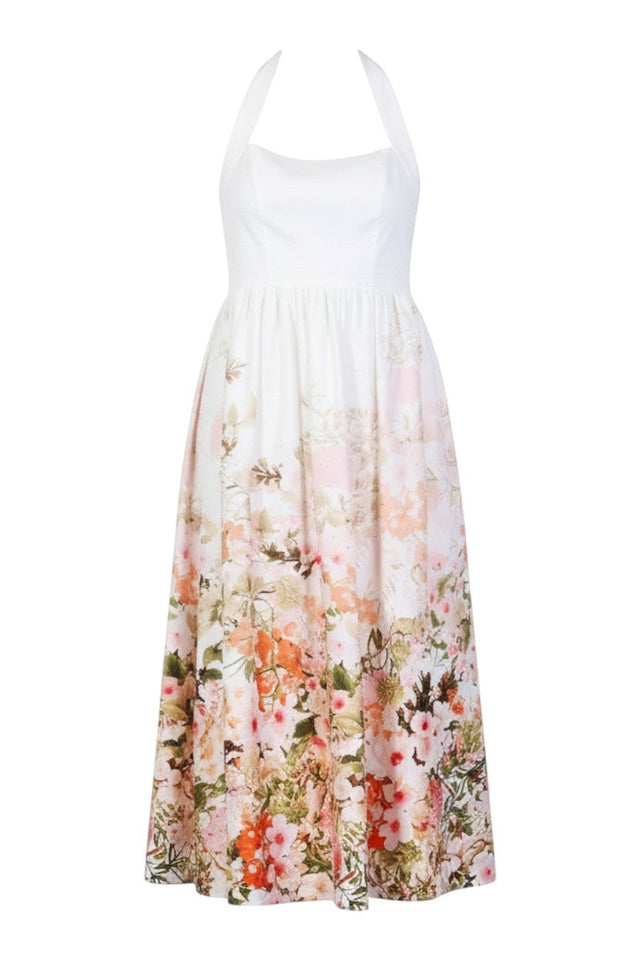 MSA Haute Couture white halter neck gown with a vibrant floral print skirt in pink, orange, and green.